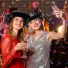 Two women wearing Black Mirror Disco Cowboy Hats at a disco party