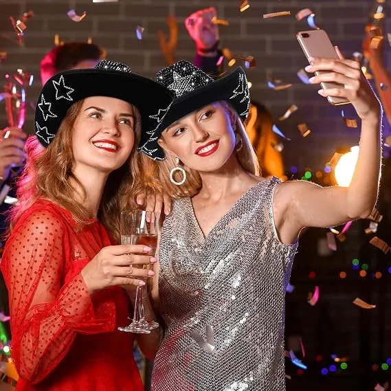 Two women wearing Black Mirror Disco Cowboy Hats at a disco party