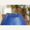 Close-up of blue glitter sequin texture on disco cowboy hat