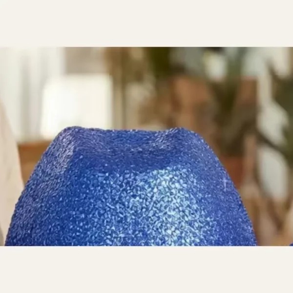 Close-up of blue glitter sequin texture on disco cowboy hat