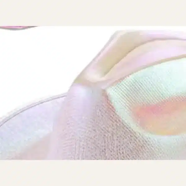 Closeup of holographic chrome cowboy hat crown showing iridescent rainbow texture