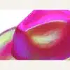 Close-up of hot pink neon sequin cowboy hat holographic texture