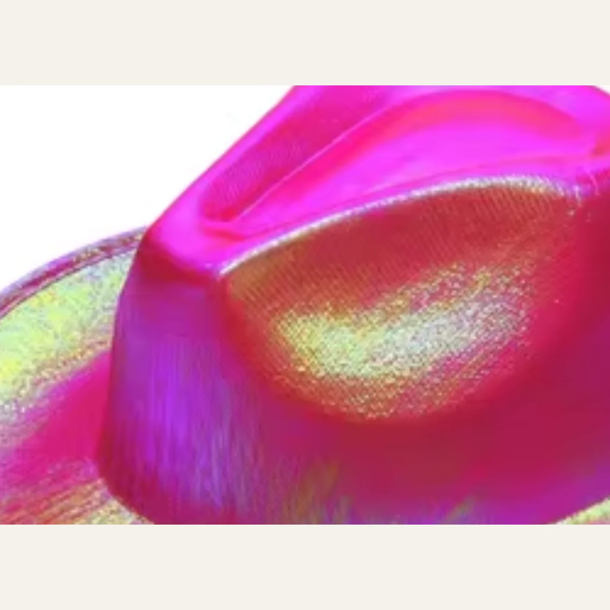 Close-up of hot pink neon sequin cowboy hat holographic texture