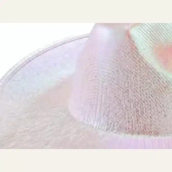 Close-up of woven pearlescent fabric texture on iridescent white disco cowboy hat