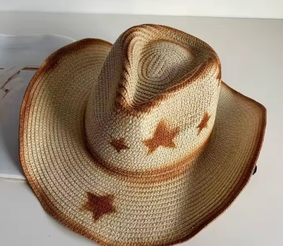 Natural straw sun cowboy hat with rust-brown star pattern band, front view