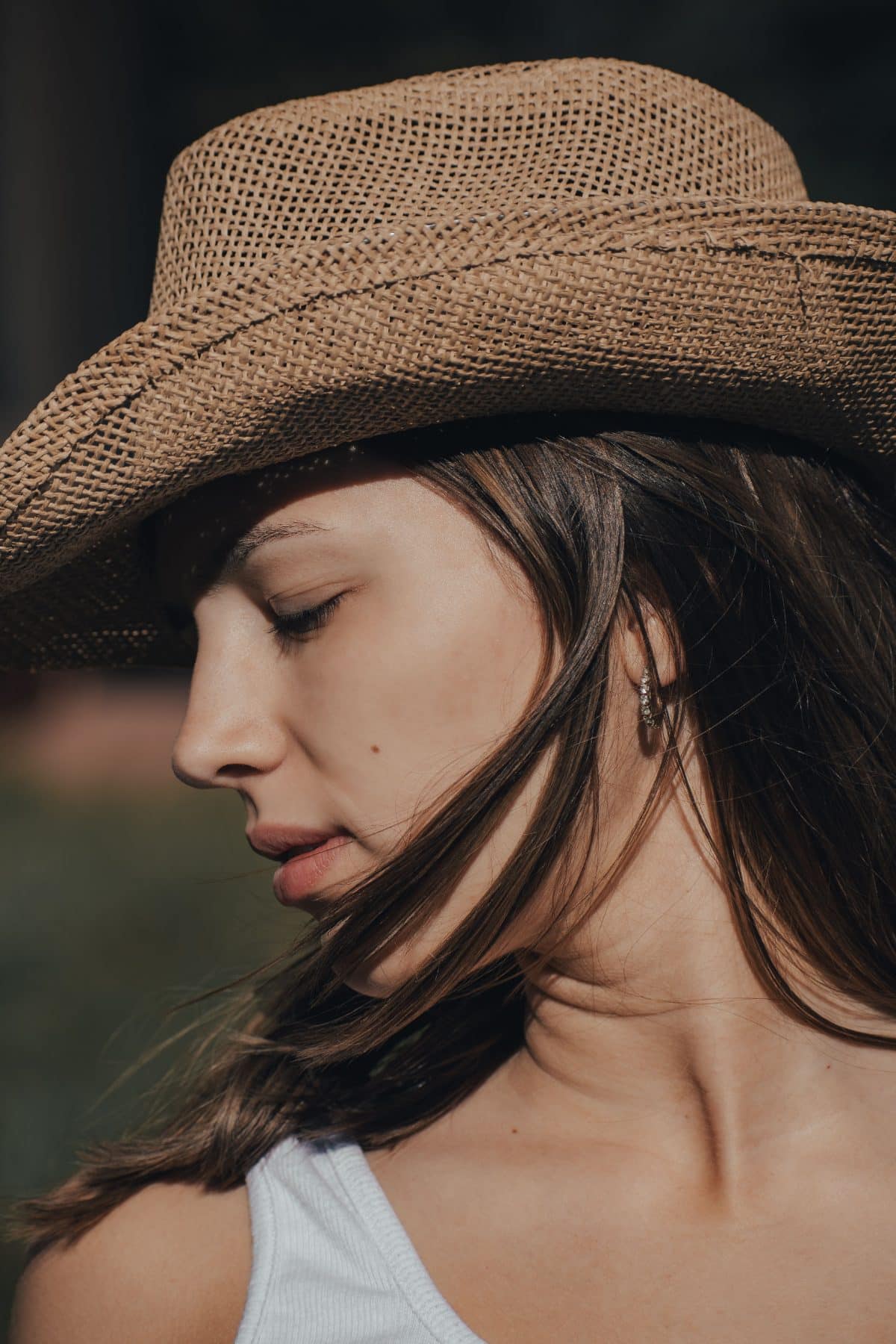 Closeup of a woman wearing a properly fitted cowboy hat