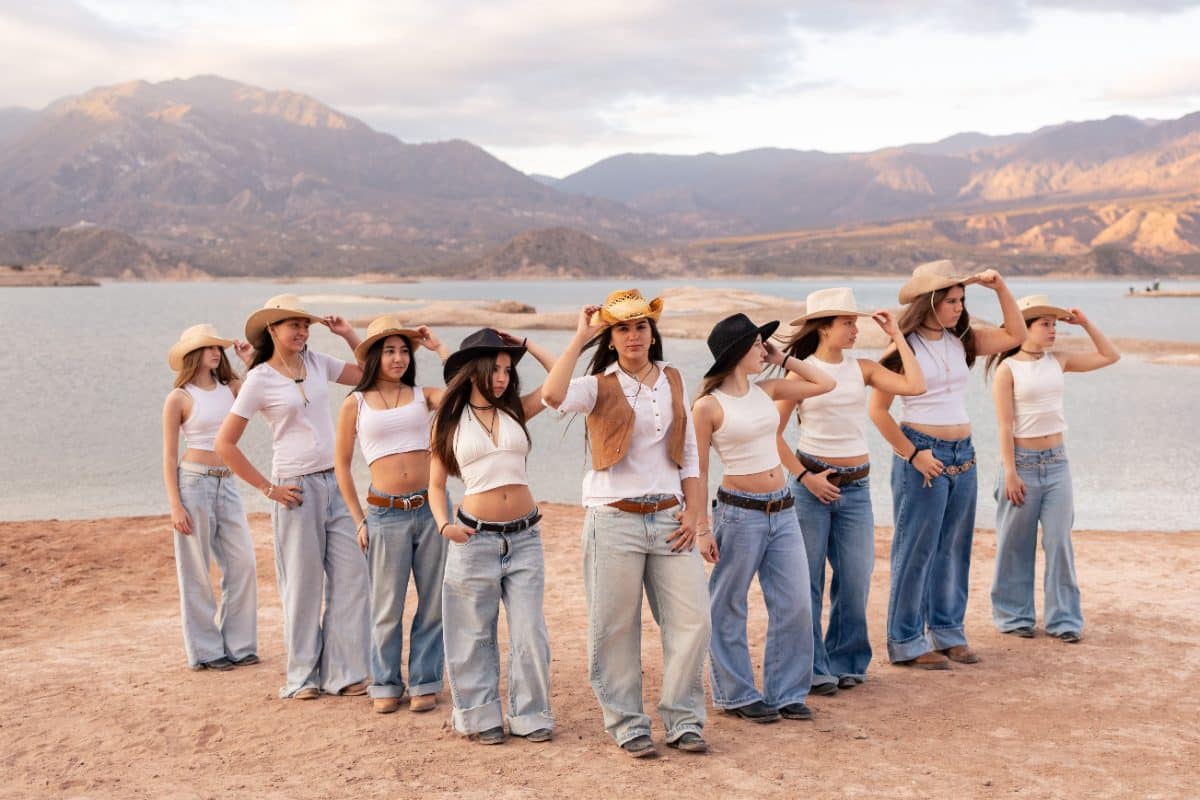 Group of women in cowboy hats celebrating a disco cowgirl bachelorette party outdoors