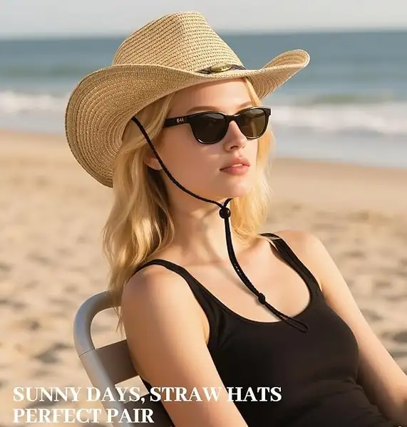 Woman wearing the Natural Straw Sun Cowboy Hat with sunglasses on a sunny beach